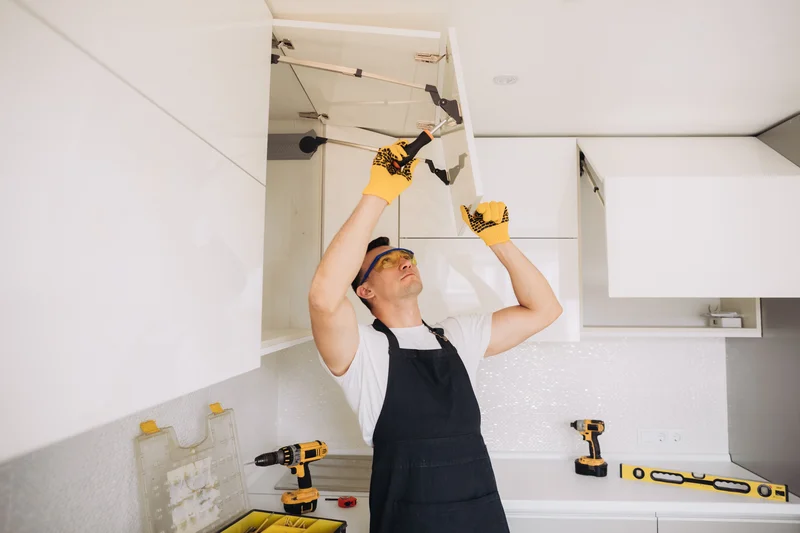 Kitchen remodeling specialist fixing cabinets in modern kitchen Kitchen remodeling specialist fixing cabinets in modern kitchen