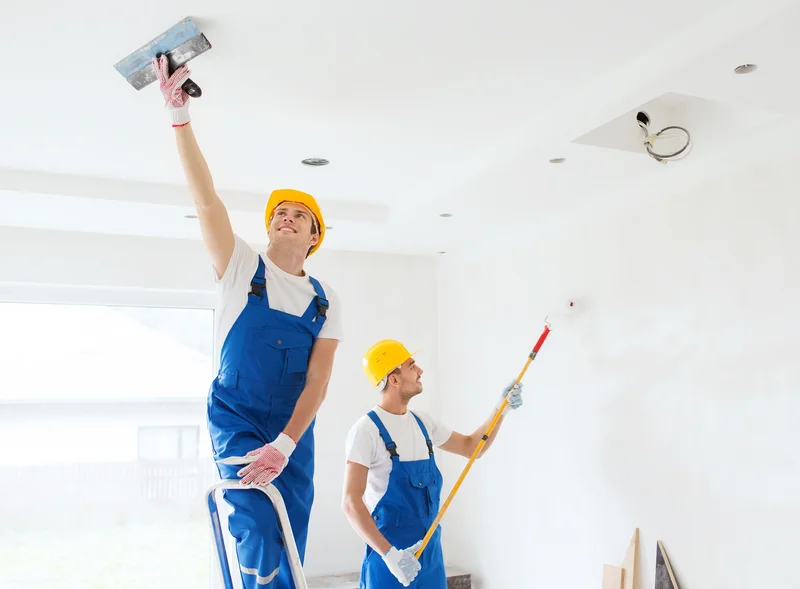 Professional painters prep and paint residential room ceiling Professional painters prep and paint residential room ceiling